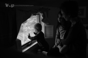family looking out window