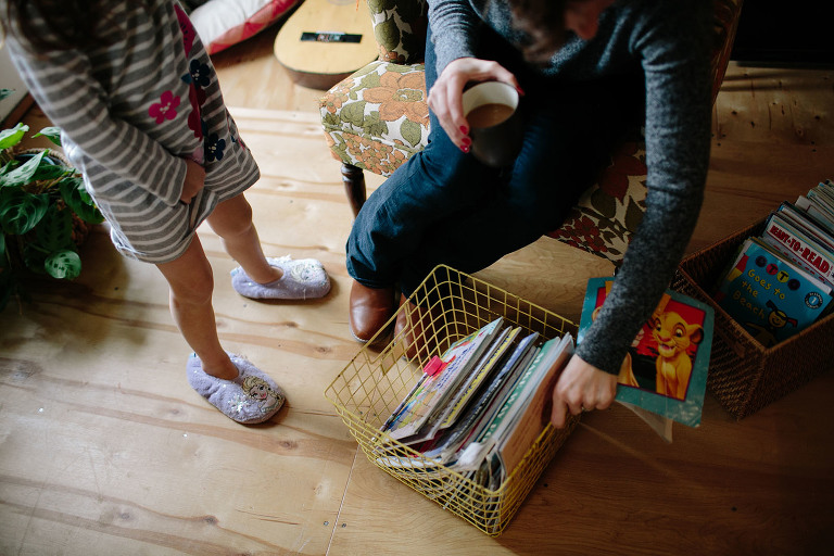 mom and daughter looking through books