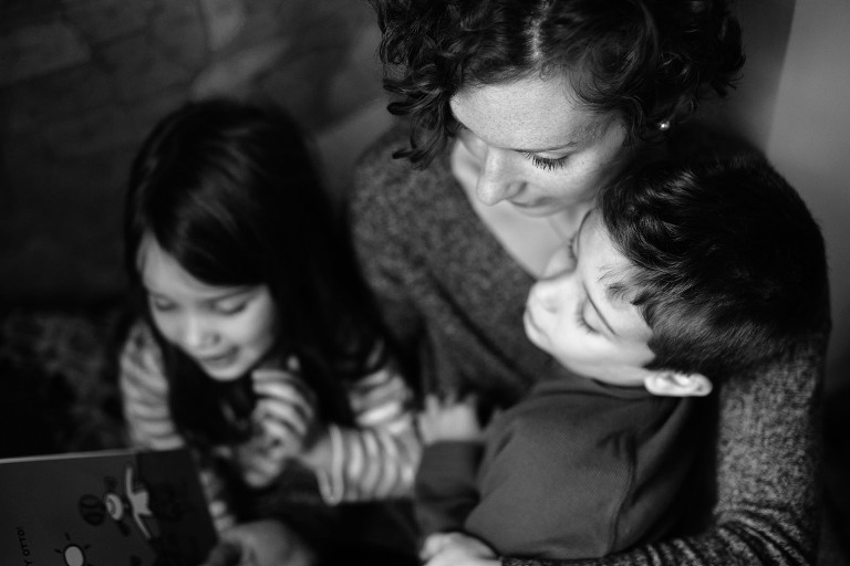 mom, son and daughter reading