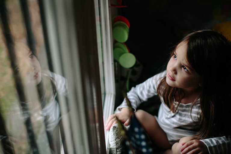girl looking at her reflection