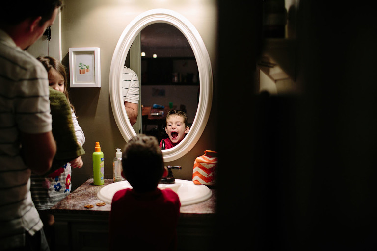 little boy looking in mirror