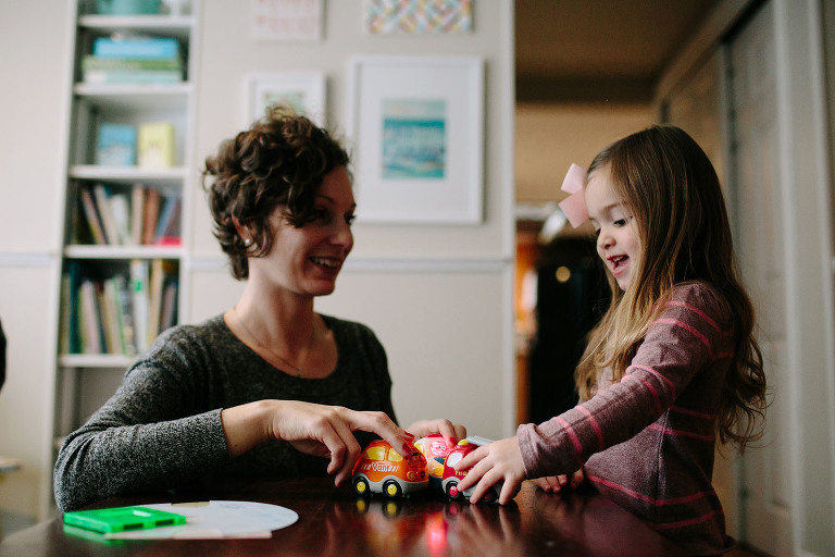 mom and daughter playing cars
