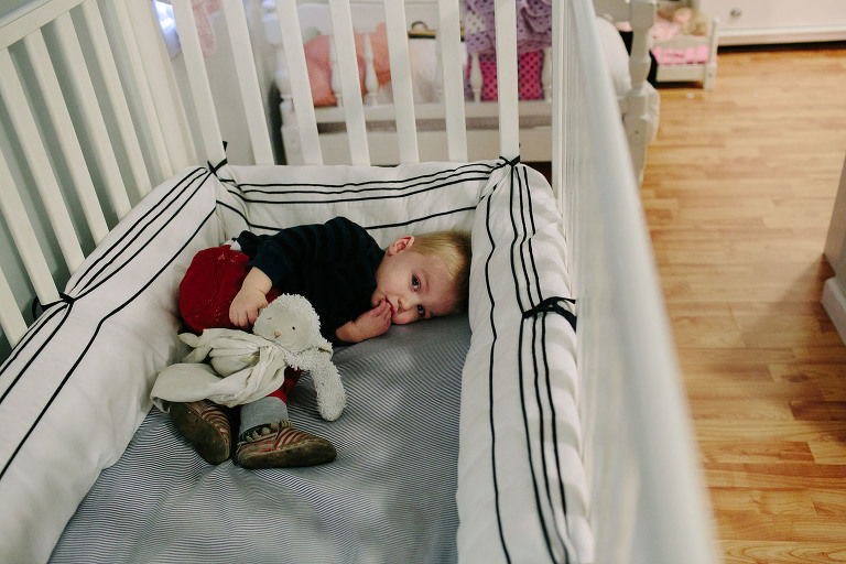 toddler in crib