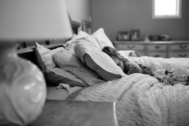 little girl in parents' bed
