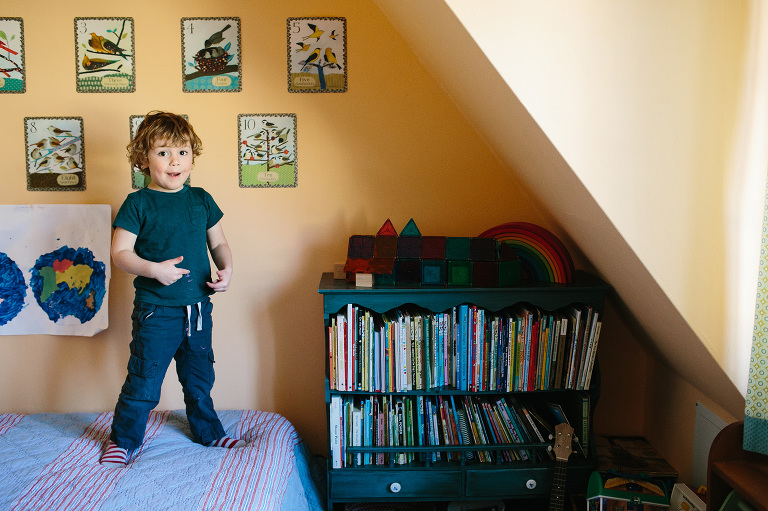 boy on bed in home family photography