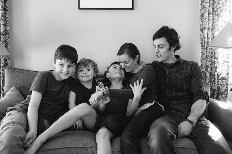 family on couch in home family photography in wyndmoor
