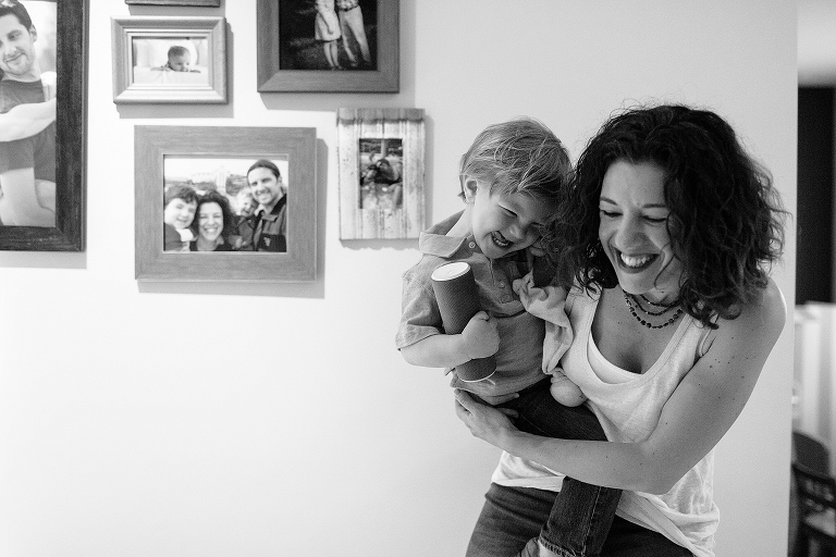 mom and sun smiling in home