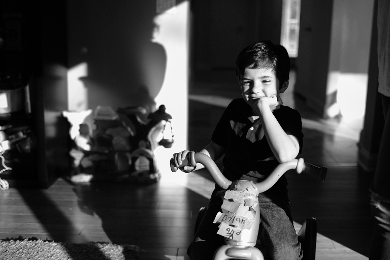 boy on bike in home