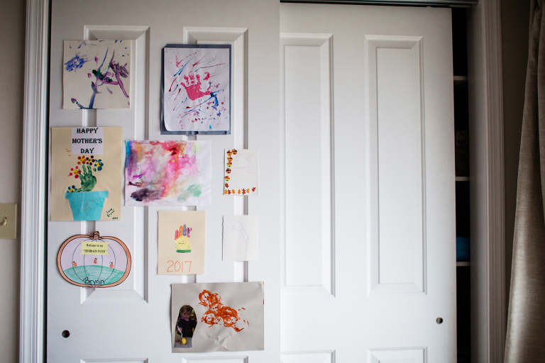 children's artwork hung on doors