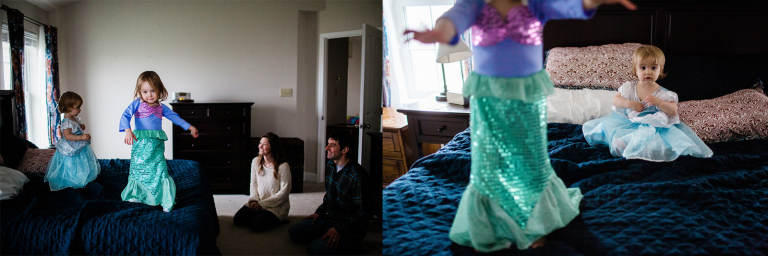 girls in princess dresses on their parents' bed while their parents watch in the background