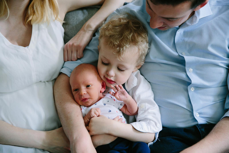 Philadelphia Newborn Photographer image of big brother and baby with parents