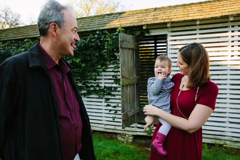 Valley forge family photograph of grandpa making silly face at granddaughter