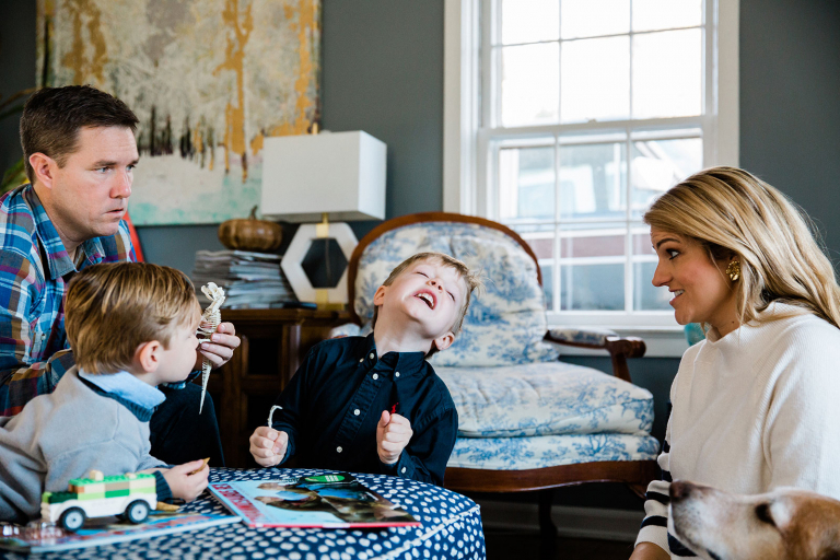 documentary family photograph of boy making silly face with family