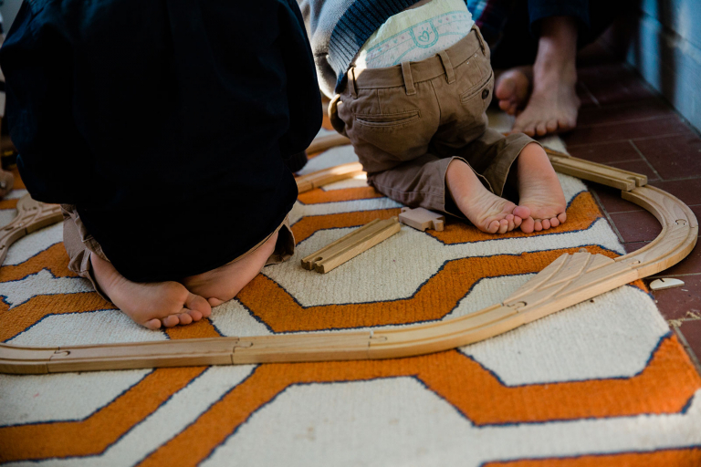 Photograph of two little boys' feet