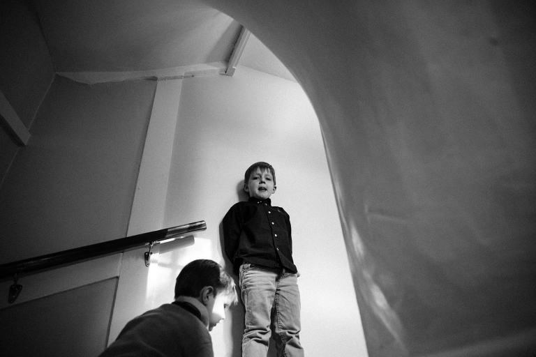 Two boys going up a curved stairway