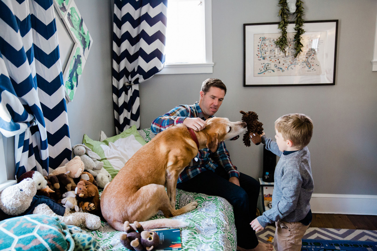 Photograph of family hanging out in little boy's bedroom