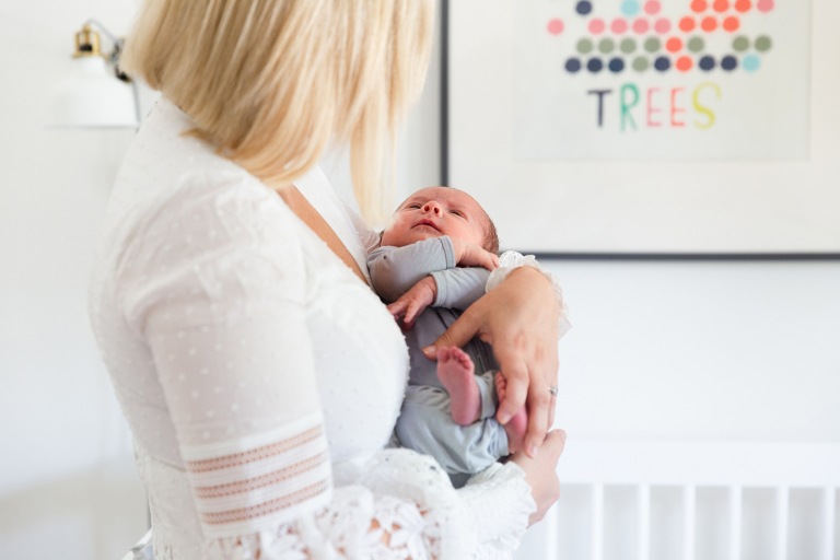 newborn baby gazing up at mom in at home newborn session