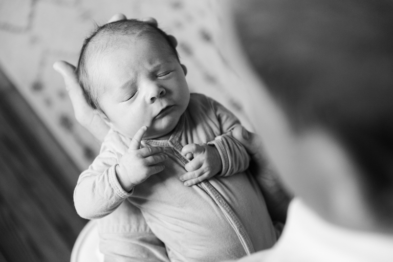 Newborn baby in dad's hands